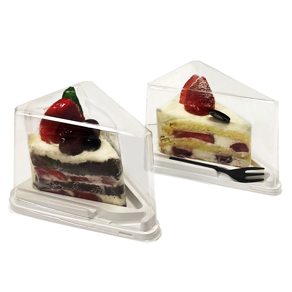 Slices of Cake in enclosed packaging with small dessert fork 